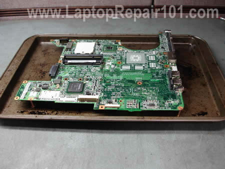 Set motherboard in baking pan