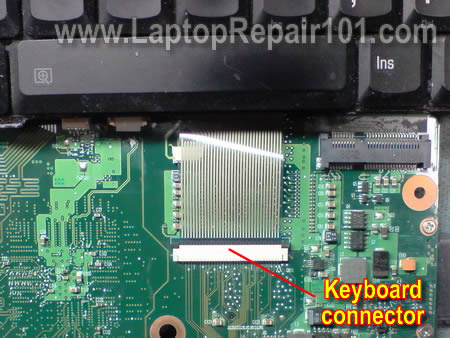 The keyboard cable is locked inside the connector on the motherboard ...