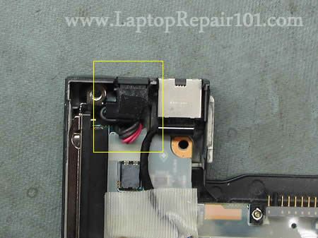  the laptop and remove the top cover assembly with the display